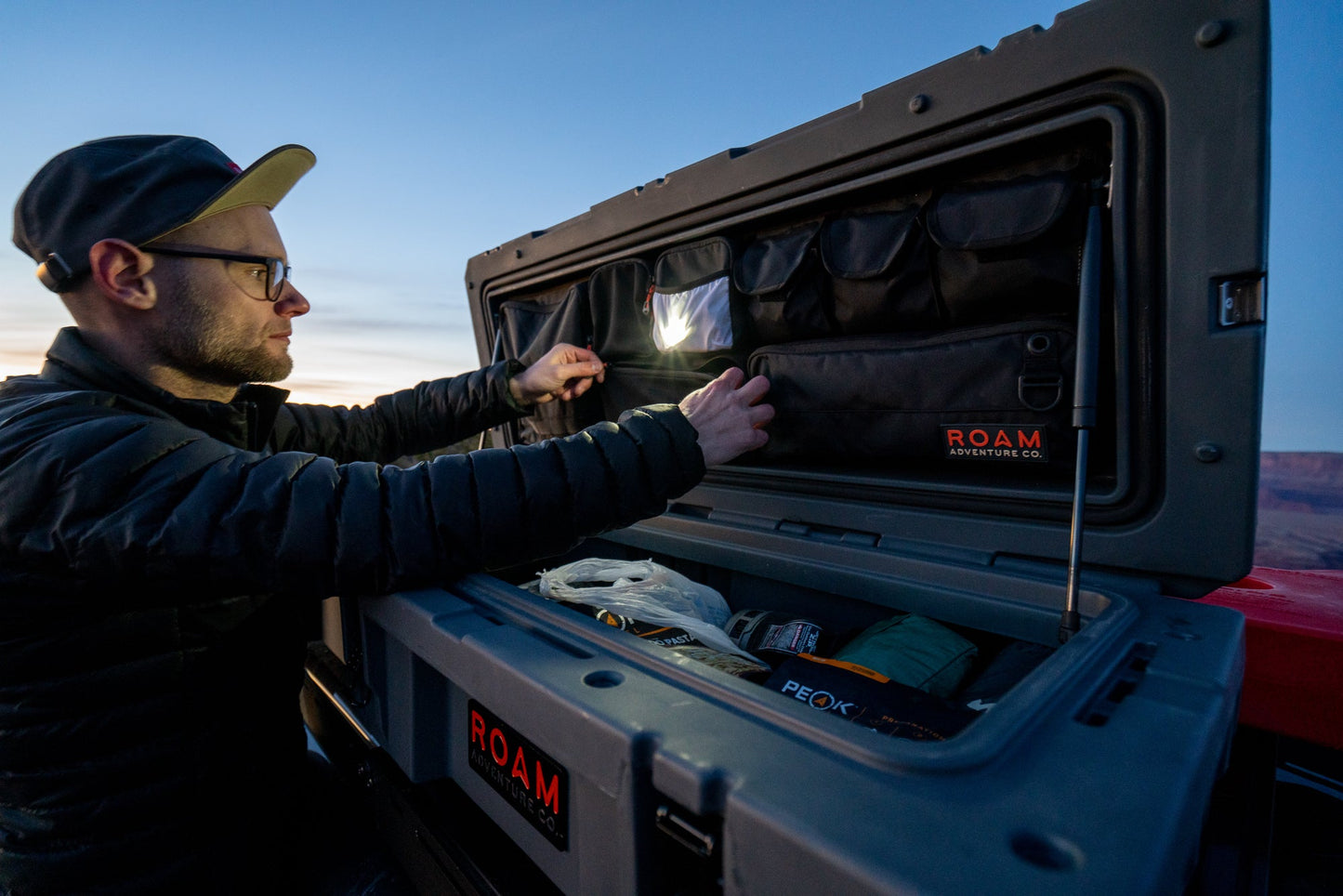 Semi-opaque pocket in a Rugged Case lid organizer for holding a light